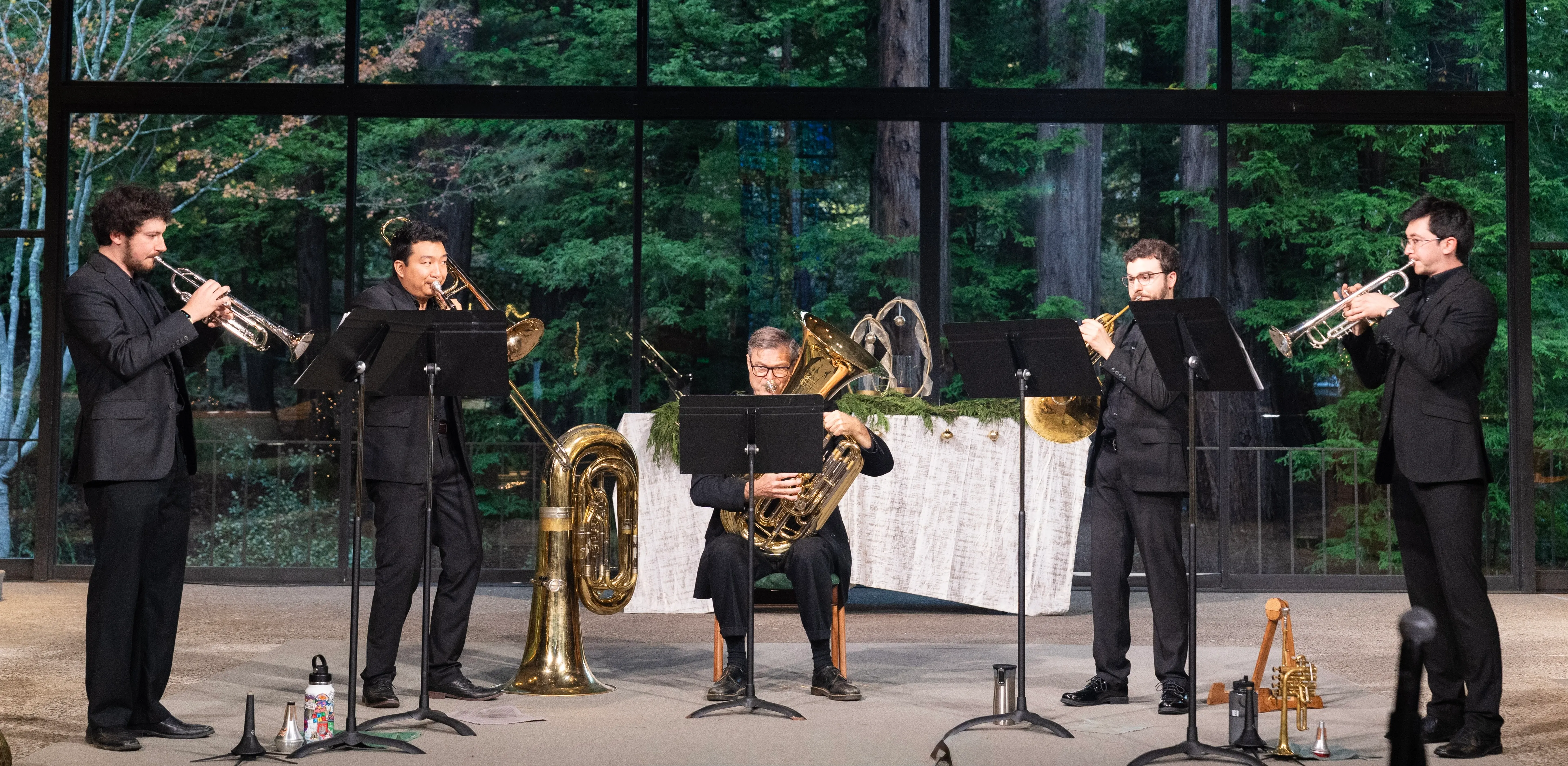 Five of a Kind brass quintet performing on stage
